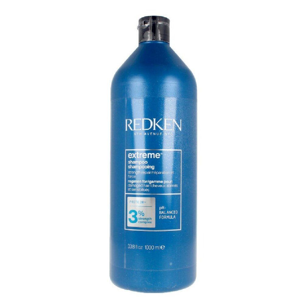 Flacone blu Redken Extreme Shampoo. Tappo nero. Testo: Extreme Shampoo, formula pH bilanciata, 1000 ml.