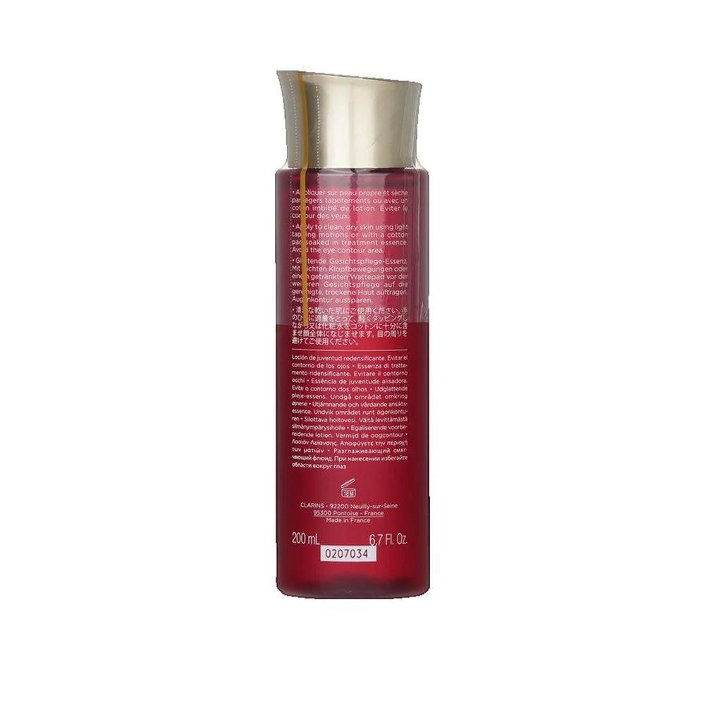 Flacone rosso con tappo dorato. Retro con testo. Testo: CLARINS, 200 ml, 6.7 fl.oz.