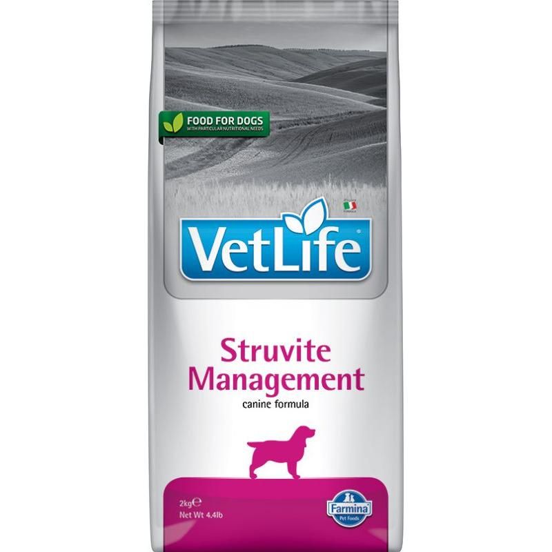Sacchetto di cibo per cani. "VetLife Struvite Management" con logo, silhouette di cane e logo Farmina. Confezione con sfondo grigio.
