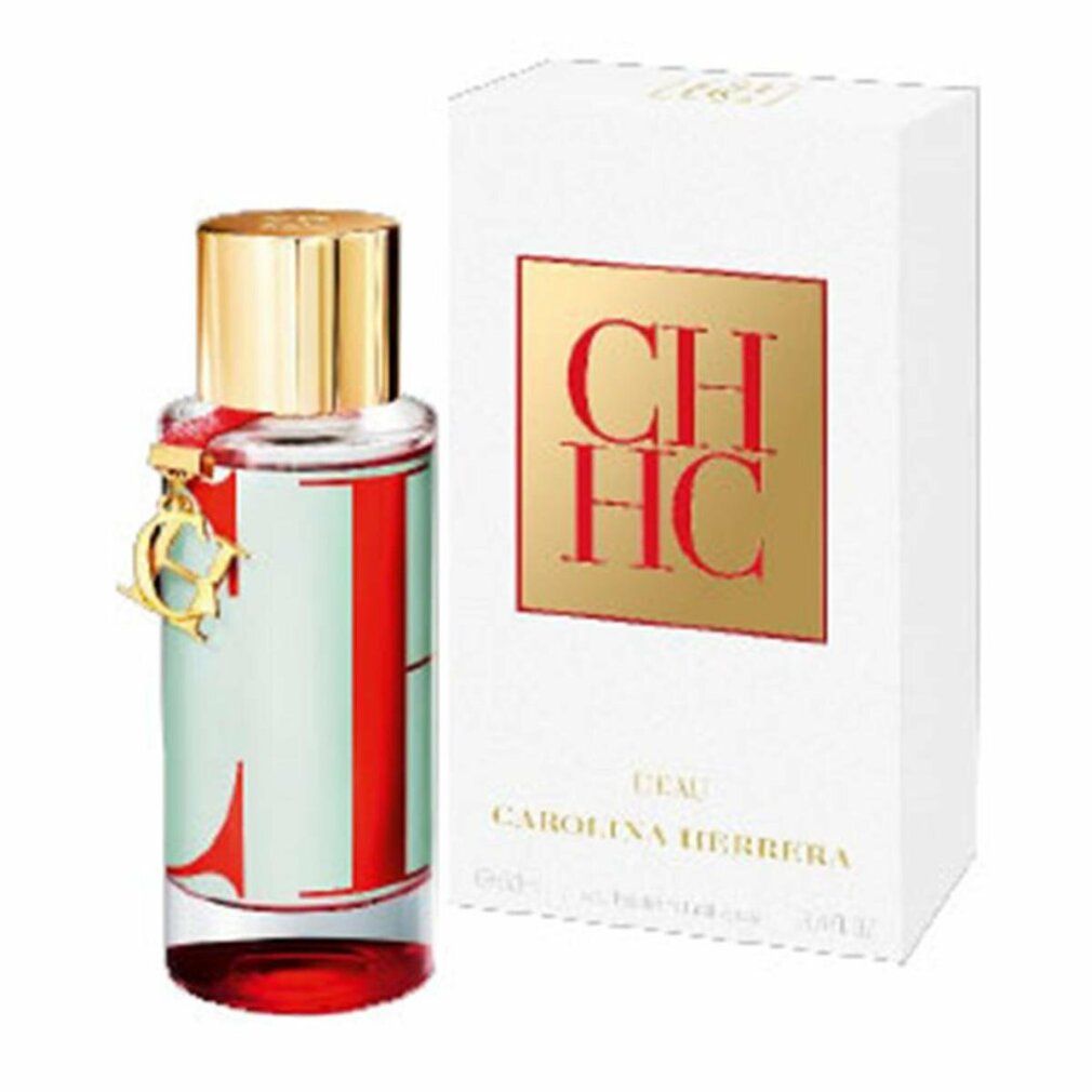 Flacone di profumo e confezione. Flacone con tappo dorato e decorazione rossa. Confezione con logo CH HC.