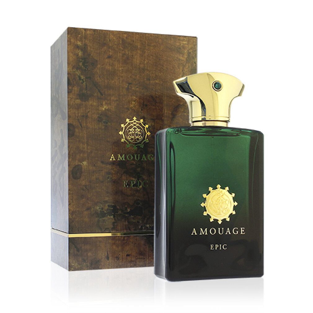 Flacone verde con tappo dorato e logo, accanto a confezione in legno. Emblema dorato e scritta.