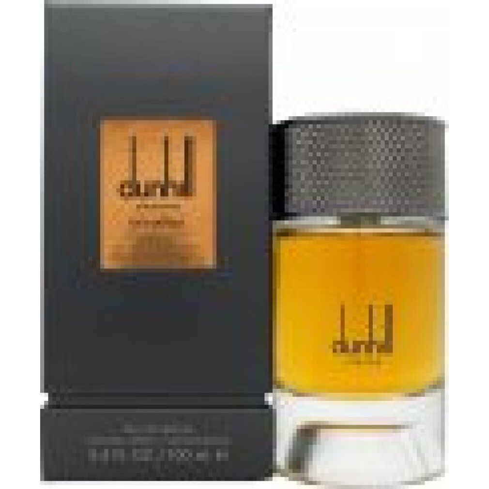 Flacone di profumo e scatola. Flacone con tappo argentato e liquido ambrato. Sulla scatola è scritto Dunhill Signature Collection Moroccan Amber.