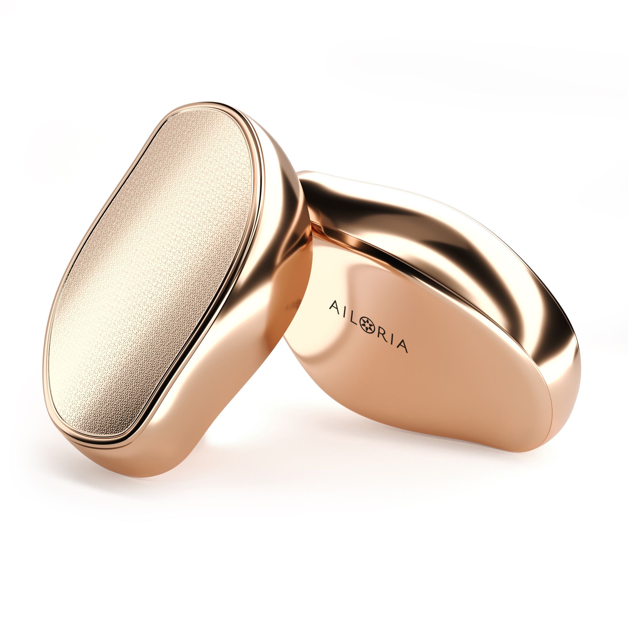 Due dispositivi ovali dorati. Uno con superficie strutturata, l'altro liscia. Logo AILORIA.