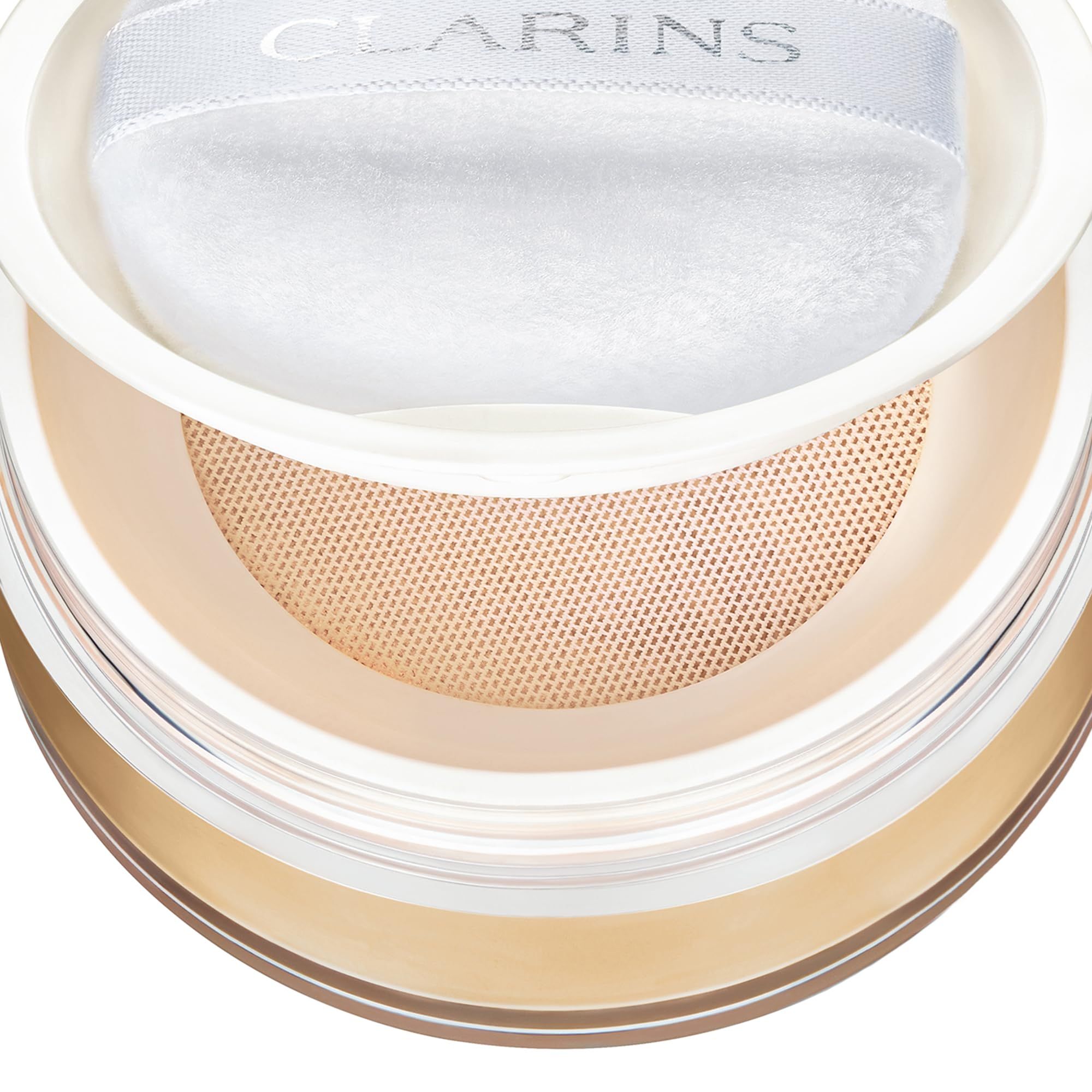 Clarins Ever Matte Loose Powder, tonalità 01. Cipria, spugna e setaccio in un contenitore.