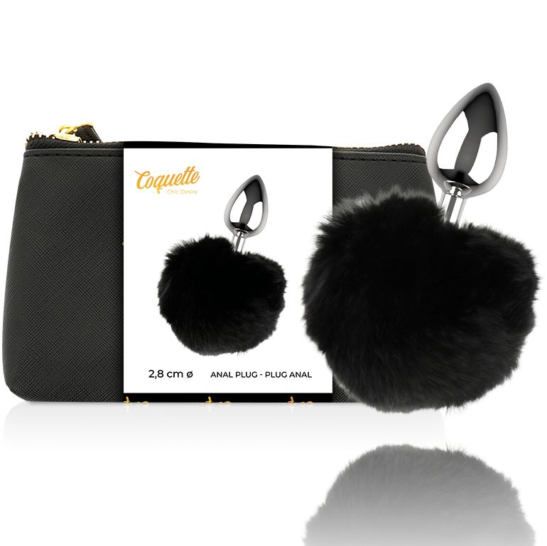 Plug anale in metallo con pompon nero. Confezionato in un astuccio nero con zip. Marchio Coquette.