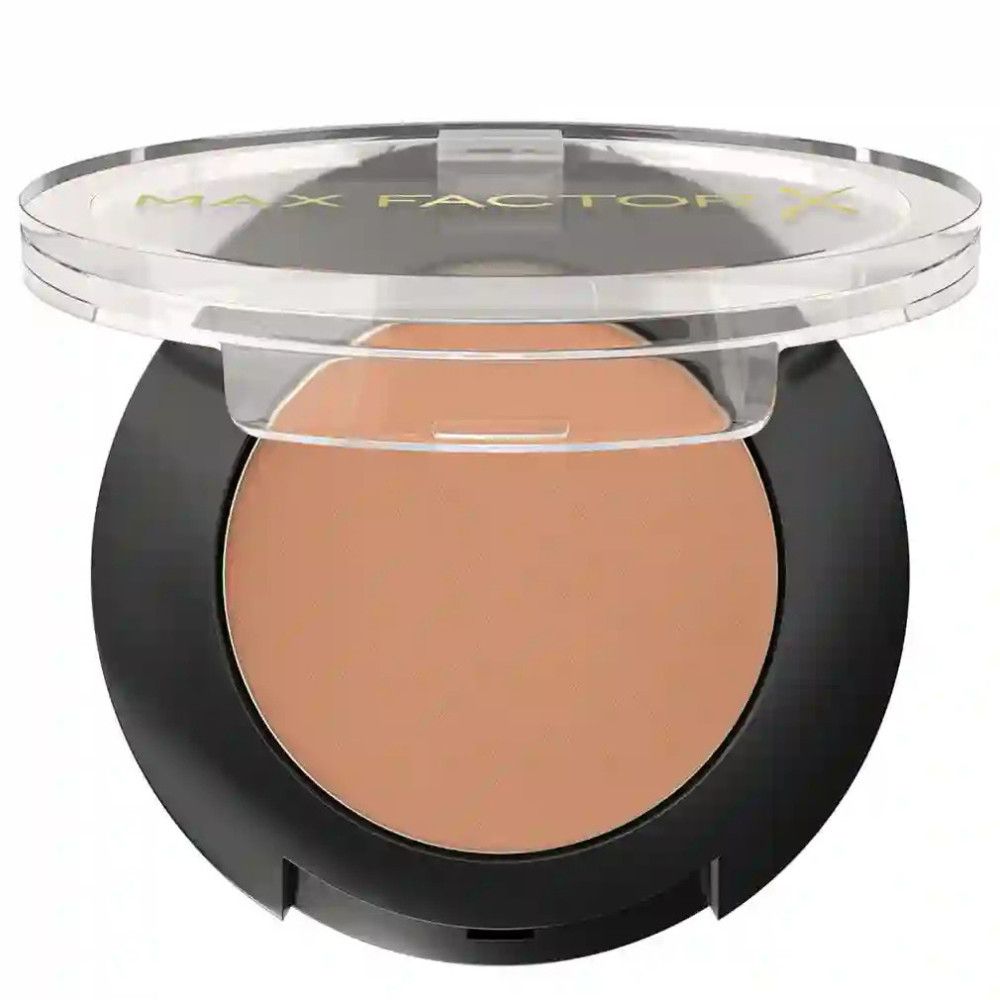 Ombretto marrone chiaro in un contenitore nero con coperchio trasparente. "MAX FACTOR" è scritto sul coperchio.