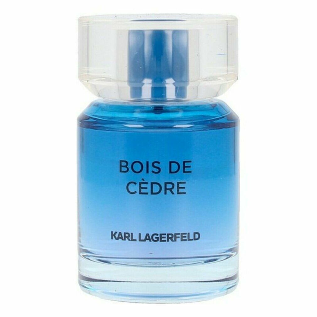 Flacone di profumo blu con tappo trasparente. Scritta: BOIS DE CÈDRE e KARL LAGERFELD.