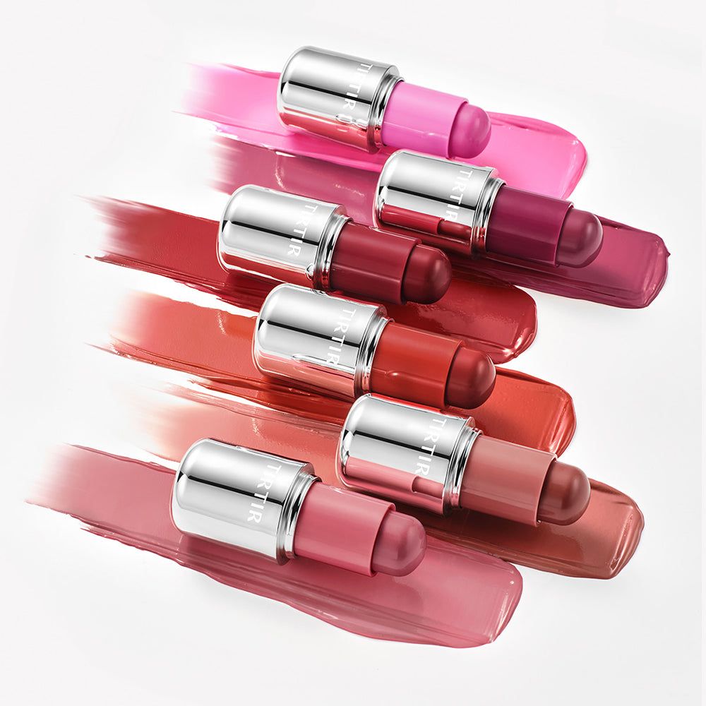 Diversi stick TIRTIR Mood Glider in vari colori su campiture di colore.
