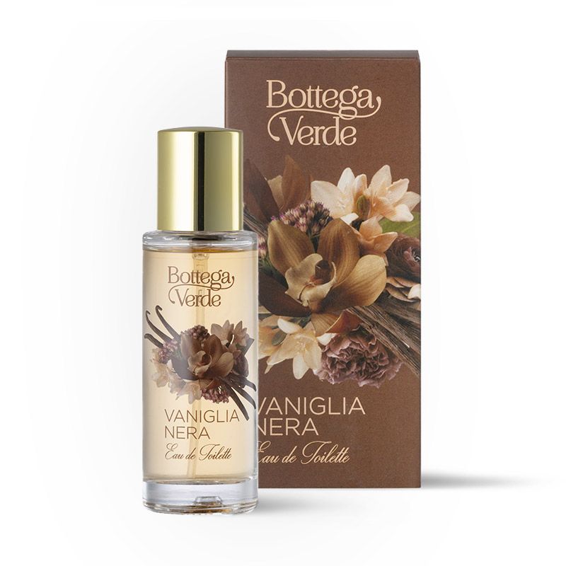 Flacone di profumo e scatola. Flacone con tappo dorato, scatola marrone con motivo floreale e scritta.