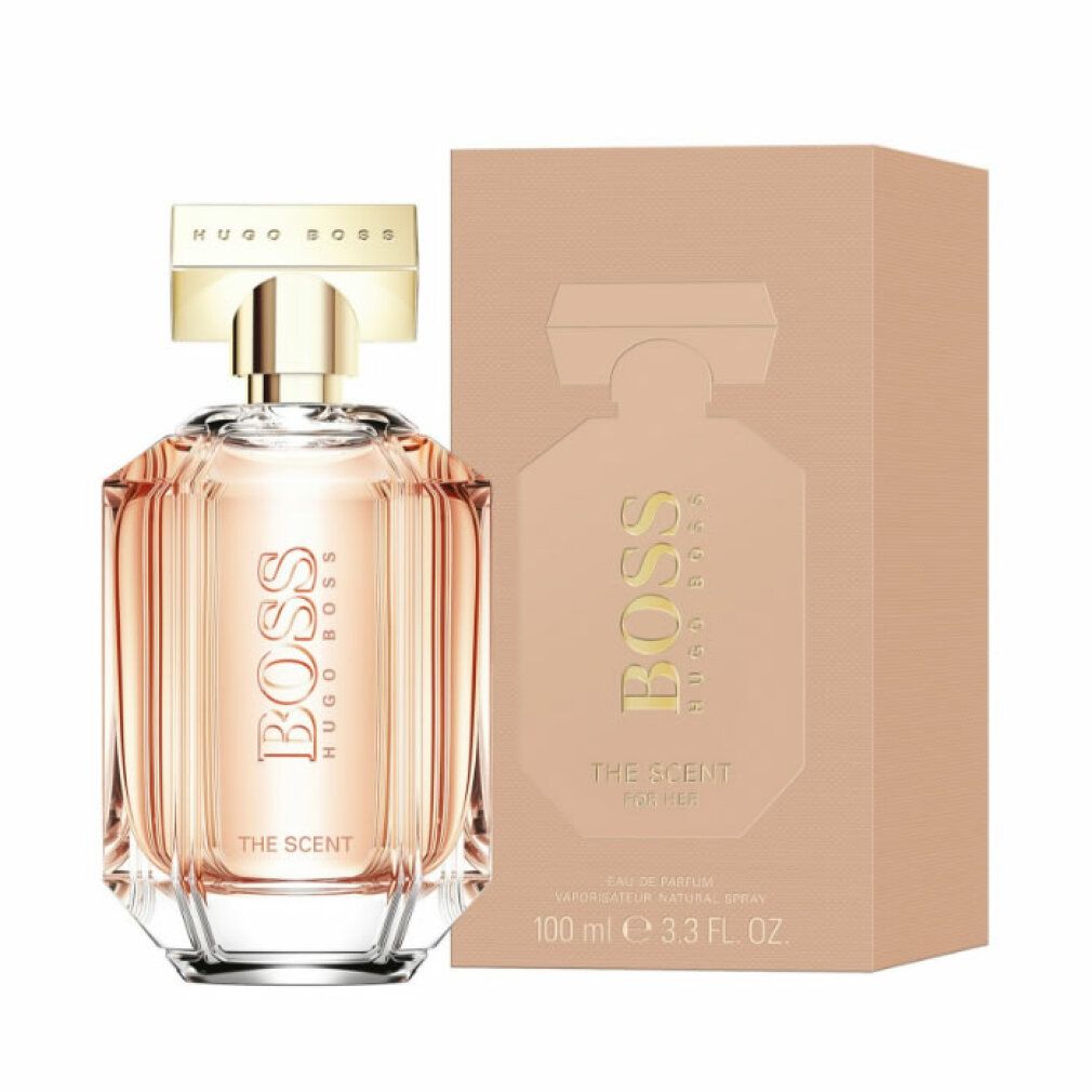 Flacone di profumo e confezione. Tappo dorato, scritta BOSS THE SCENT. Confezione con immagine del prodotto e scritta 100 ml.