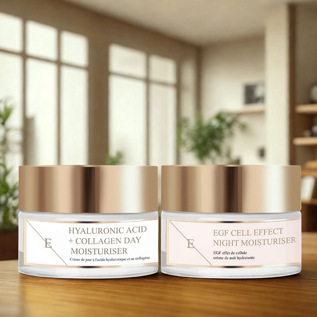 Due vasetti di crema con coperchi dorati ed etichette. Scritta: Crema giorno acido ialuronico + collagene e Crema notte EGF Cell Effect. Su tavolo.