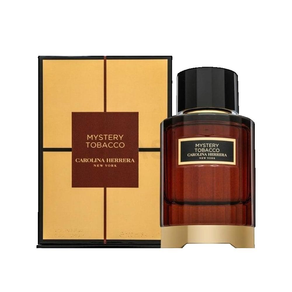 Flacone di profumo e confezione. Bottiglia rettangolare con liquido marrone. Confezione dorata con nome del prodotto.