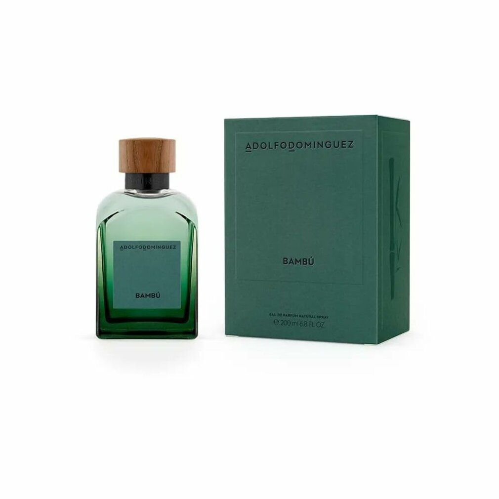 Flacone di vetro verde con tappo in legno e confezione verde. Sul flacone è scritto "Bambú". La confezione riporta il nome "ADOLFO DOMINGUEZ".