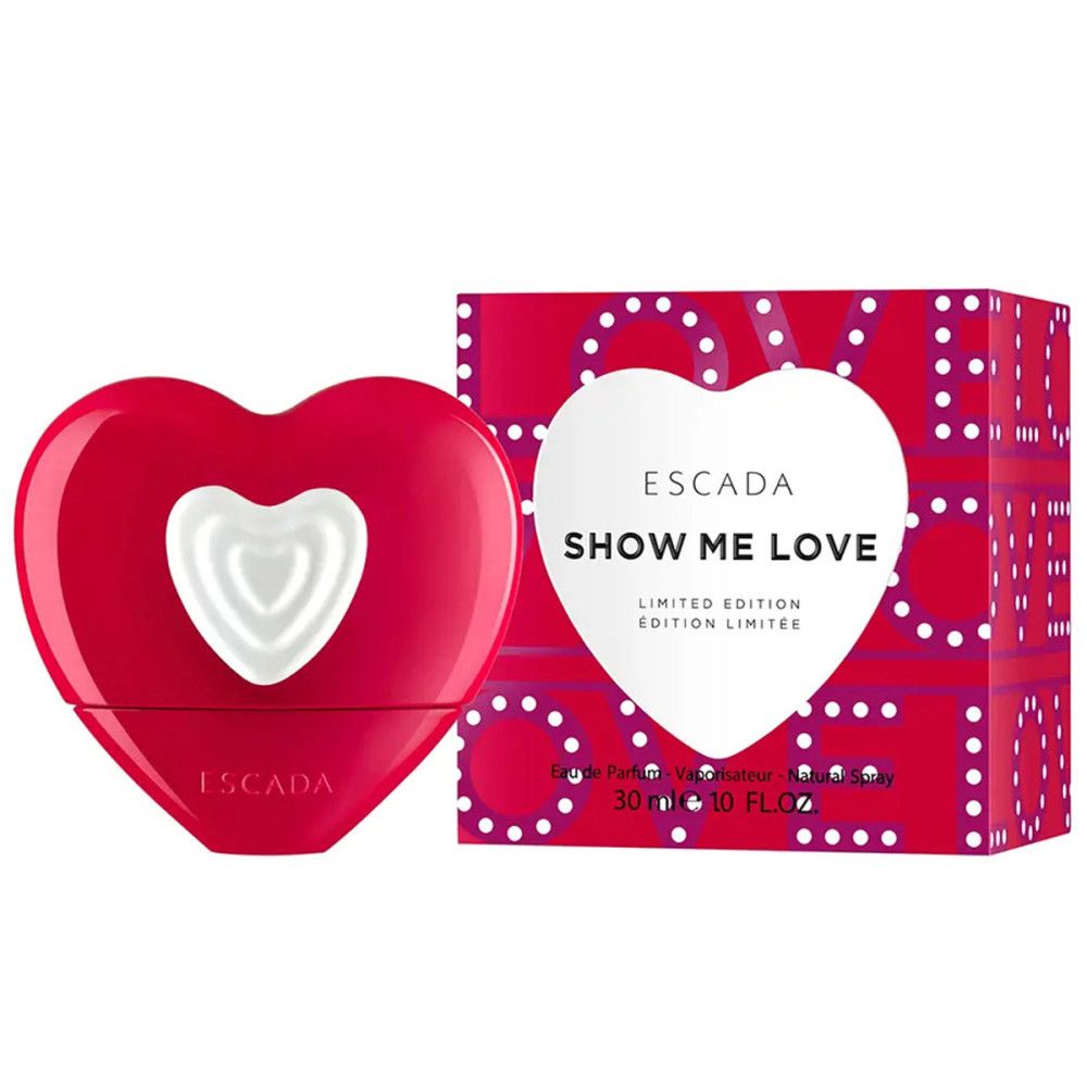 Flacone rosso a forma di cuore con cuore bianco. Scatola con scritta "SHOW ME LOVE" e "ESCADA".