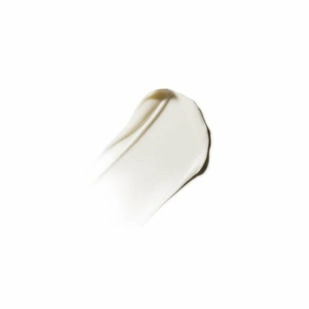 Una macchia di crema su sfondo bianco. La crema è chiara e lucida.