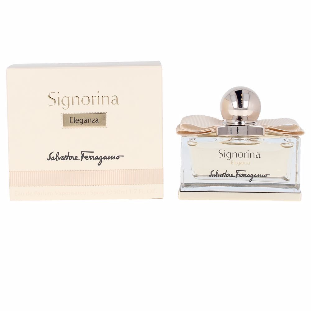 Flacone di profumo e confezione. Flacone con fiocco e tappo. Scritta Signorina Eleganza e Salvatore Ferragamo.