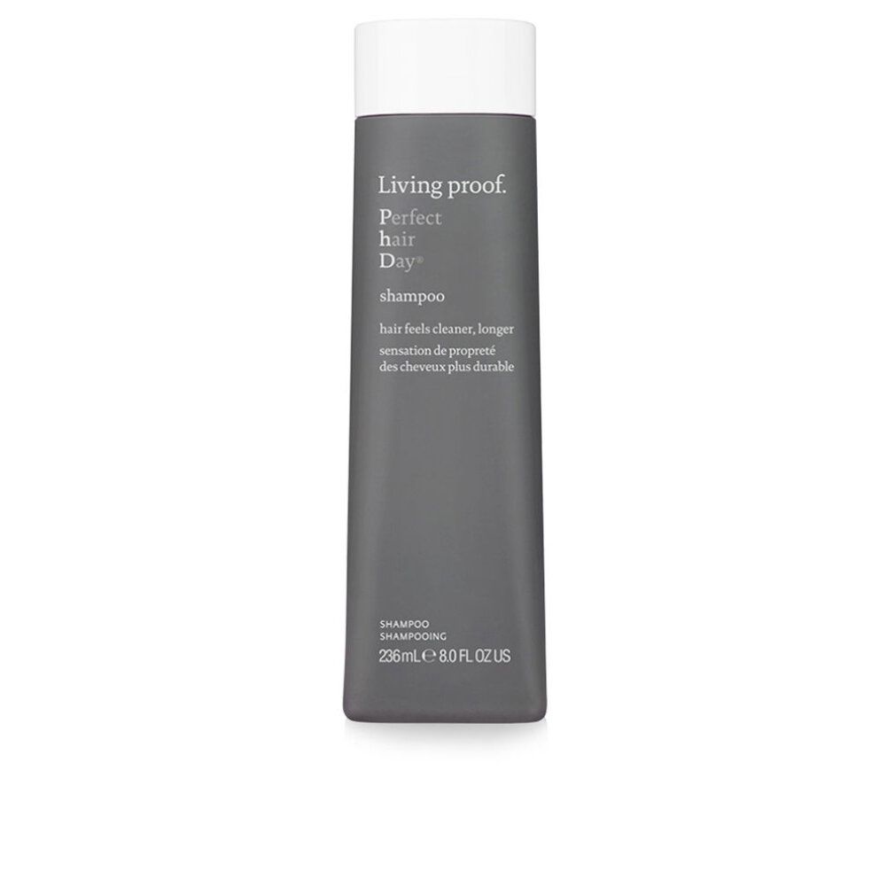 Flacone di shampoo grigio con tappo bianco. Testo e nome del prodotto.