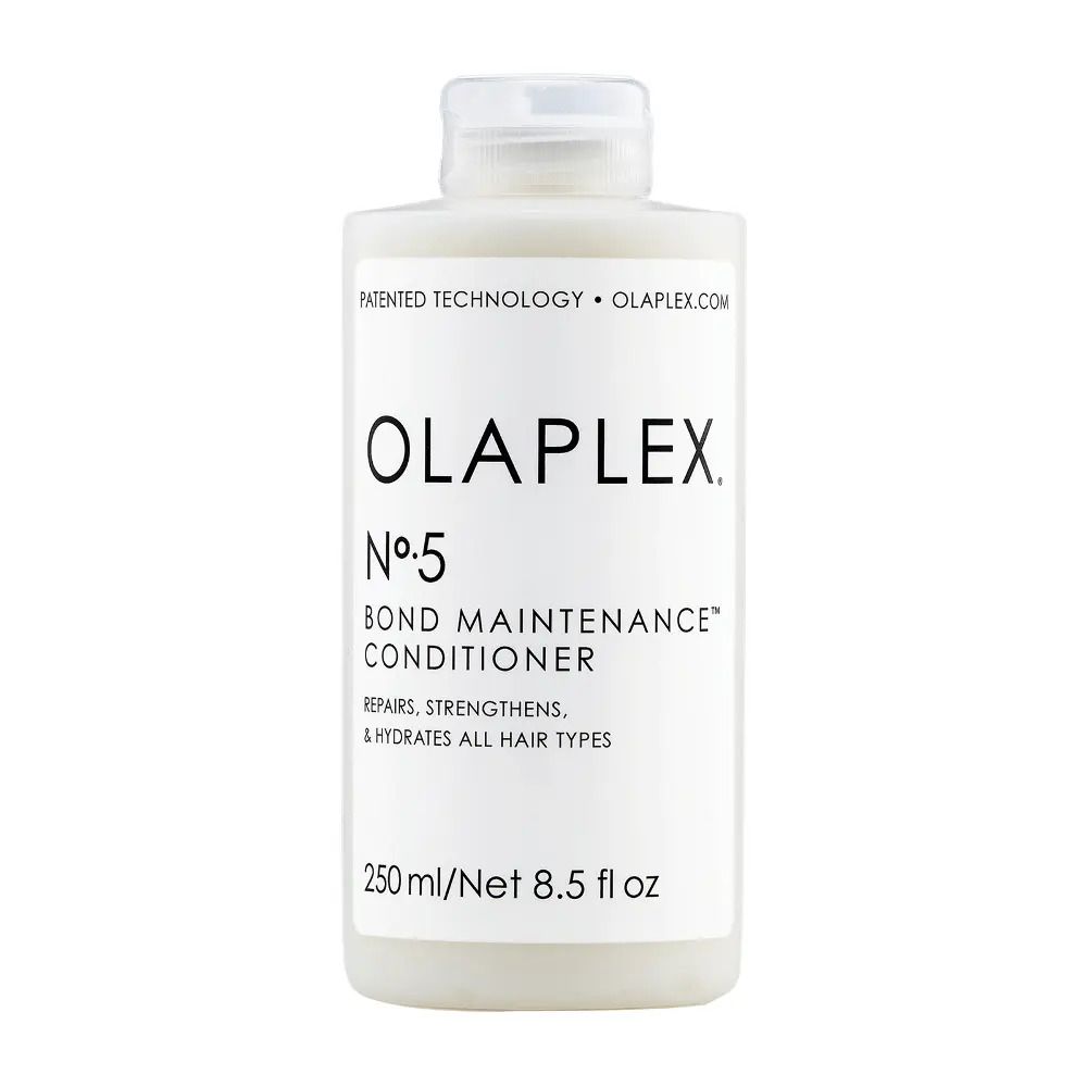 Flacone bianco Olaplex Nº5 Bond Maintenance Conditioner. Contiene 250 ml/8,5 fl oz. Ripara, rinforza e idrata tutti i tipi di capelli.