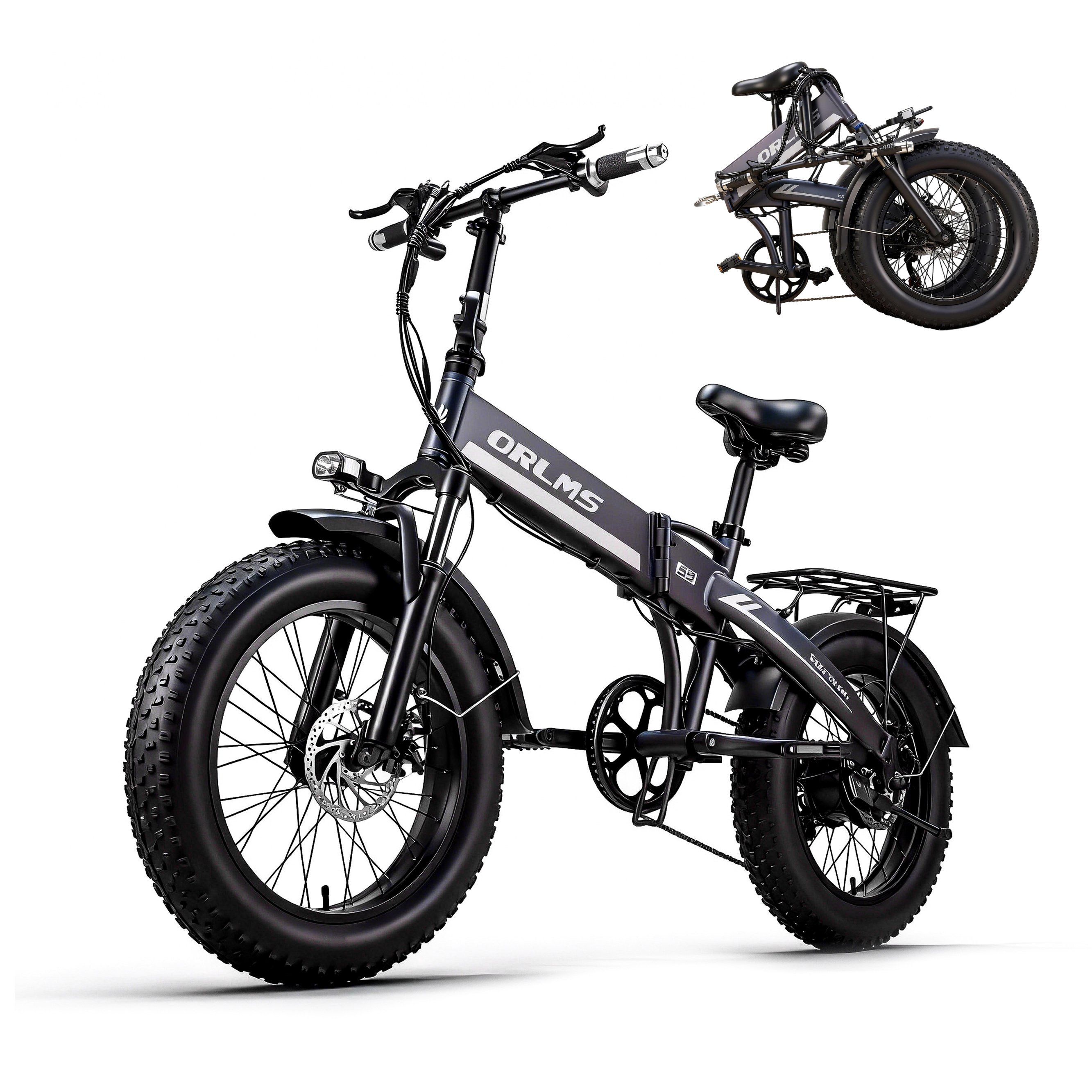 E-bike grigia, piegata e aperta. Logo ORLMS visibile. Pneumatici larghi. Bicicletta aggiuntiva sullo sfondo.