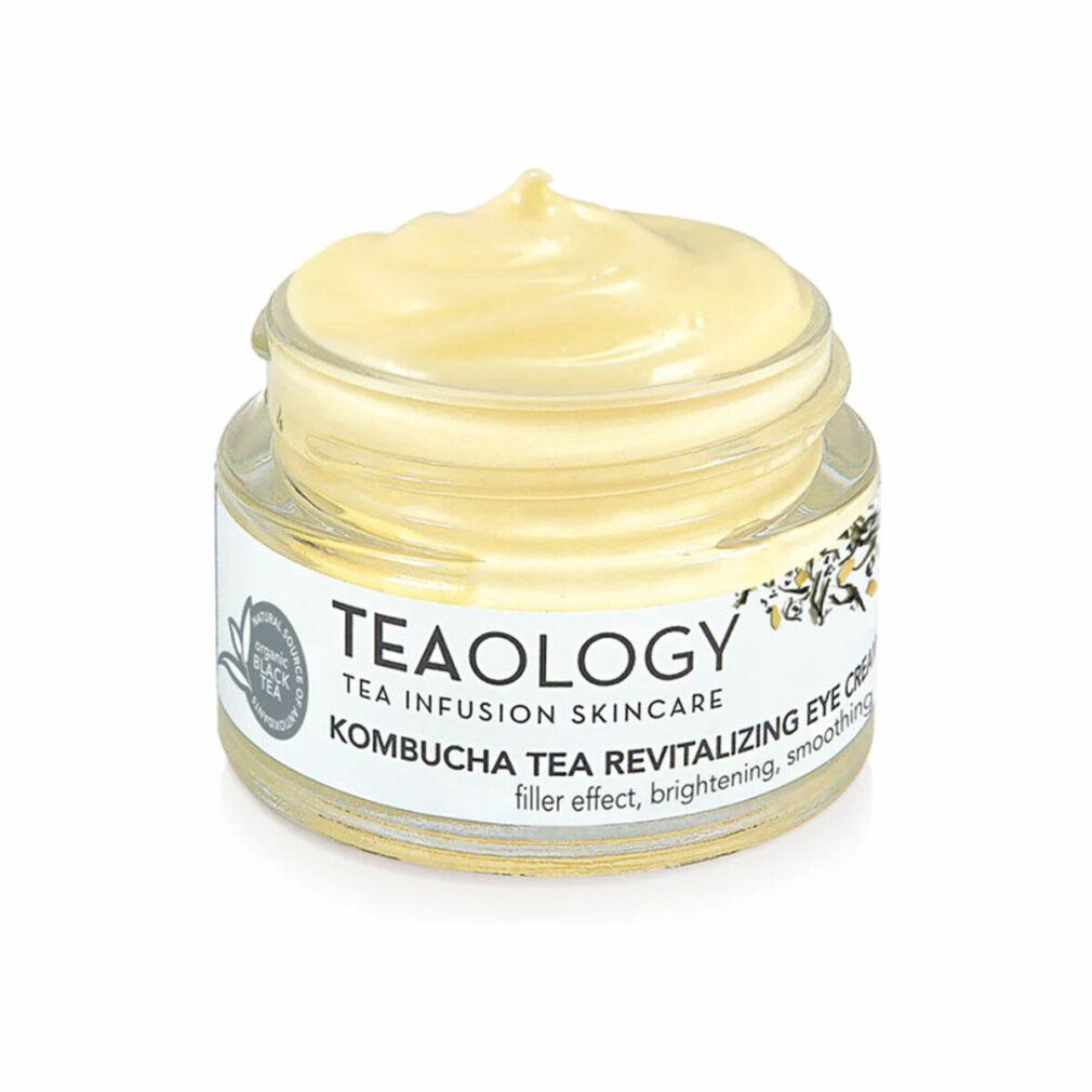 Vasetto in vetro con crema giallastra. L'etichetta riporta "TEAOLOGY", "Kombucha Tea Revitalizing Eye Cream".