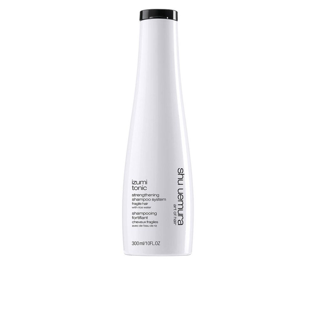 Flacone bianco con tappo nero. Testo: Izumi Tonic, Strengthening Shampoo System, Shu Uemura Art of Hair. 300ml/10FL.OZ.