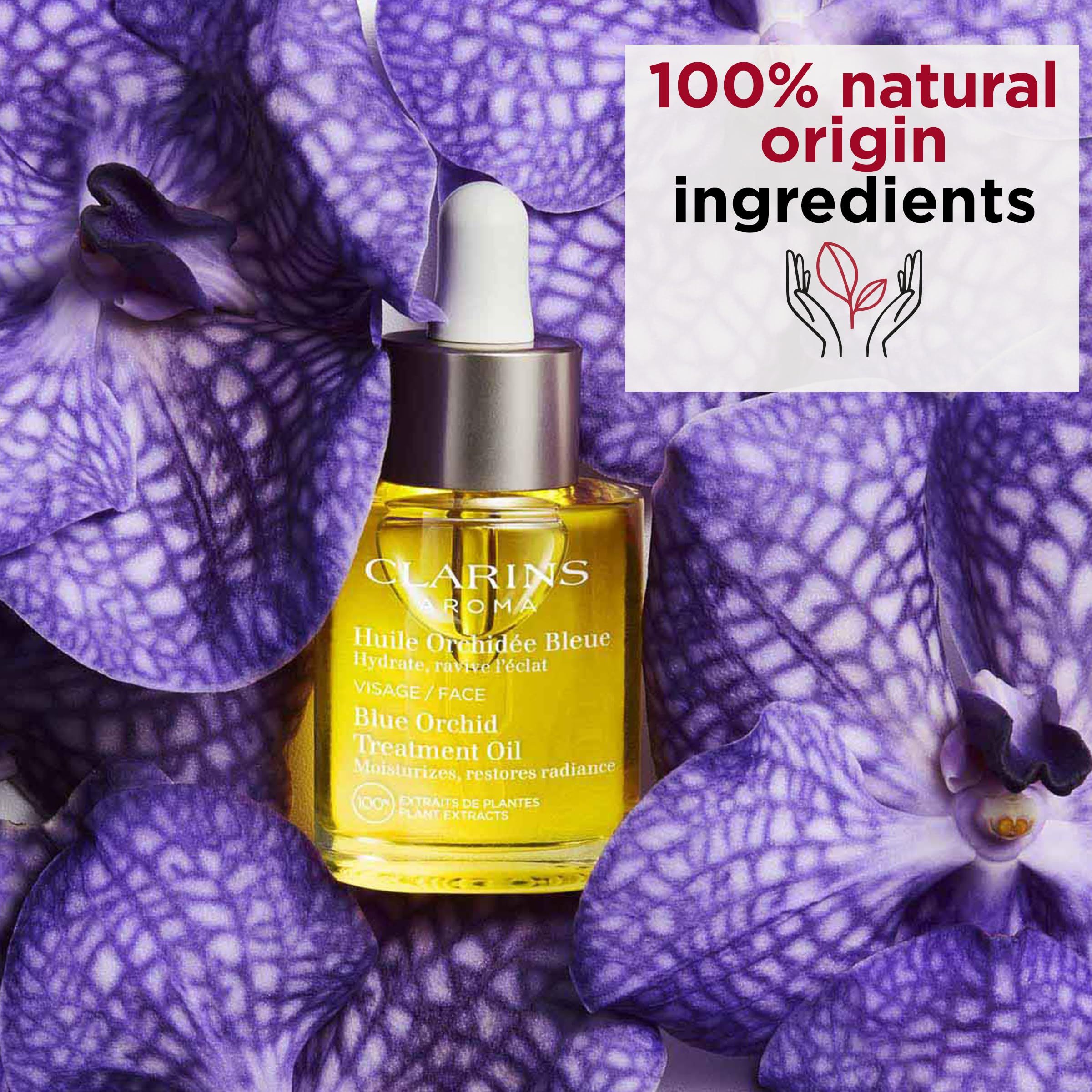 Flacone di vetro di olio giallo con contagocce, circondato da fiori di orchidea viola. Testo: "100% ingredienti naturali".