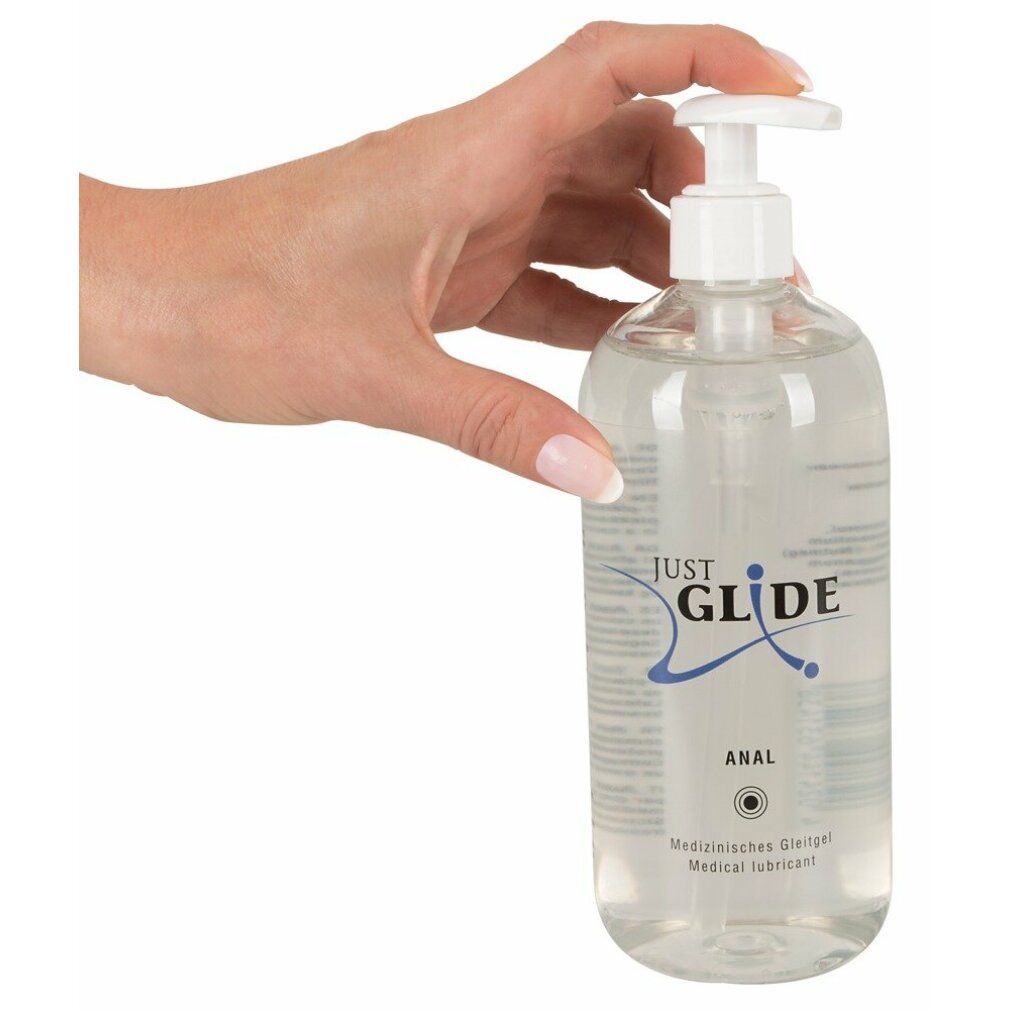 Mano che tiene un flacone trasparente con dosatore. Scritta: Just Glide Anal. Gel lubrificante medico.