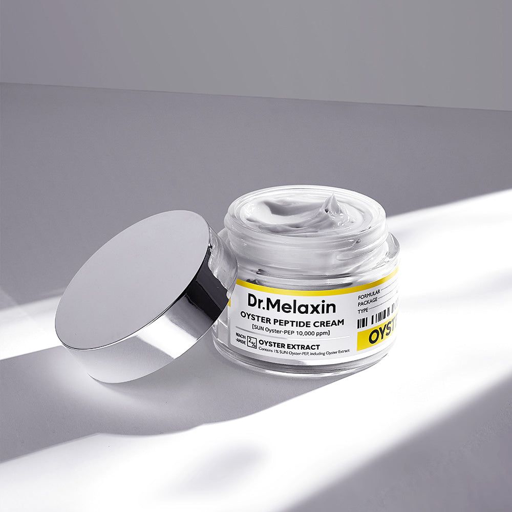 Crema peptidica di ostrica Dr. Melaxin in un barattolo di vetro con coperchio aperto.