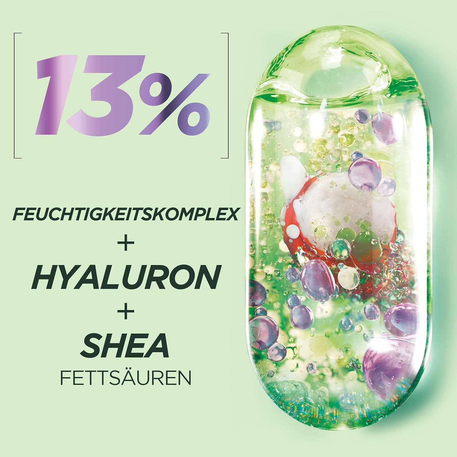 Primo piano di un liquido con bolle. Testo: 13%, complesso idratante + ialurone + acidi grassi di karité.