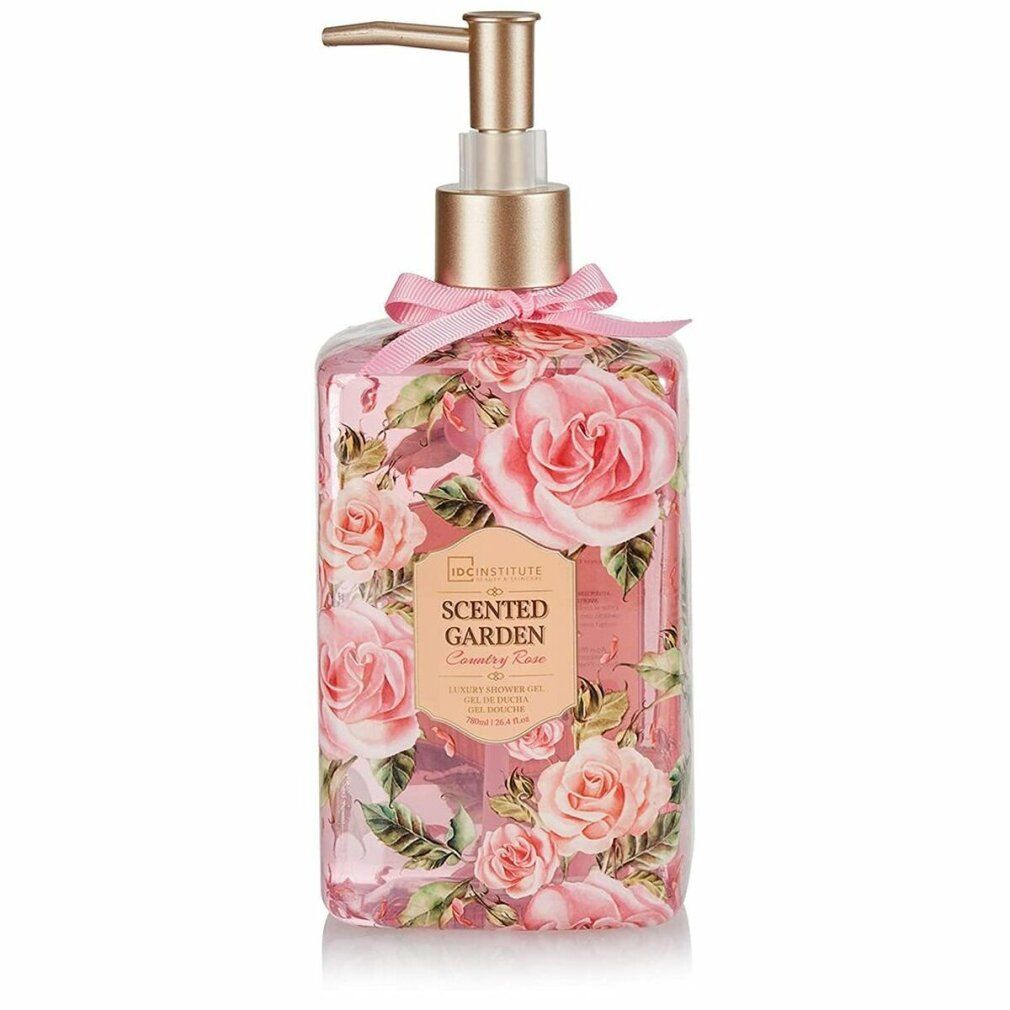 Flacone trasparente con rose, dispenser dorato e fiocco rosa. Scritta: IDC INSTITUTE Scented Garden.