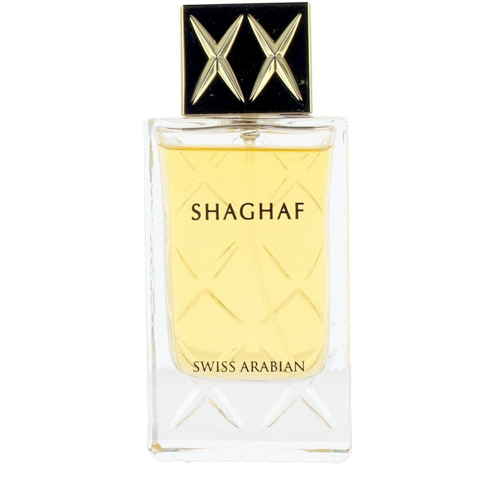 Flacone di profumo con tappo dorato e scritta. Flacone con tappo dorato e forma quadrata.