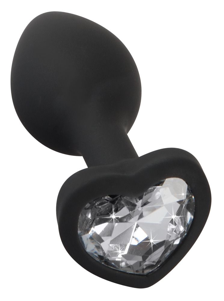Mano che tiene un plug anale in silicone nero con strass a forma di cuore.