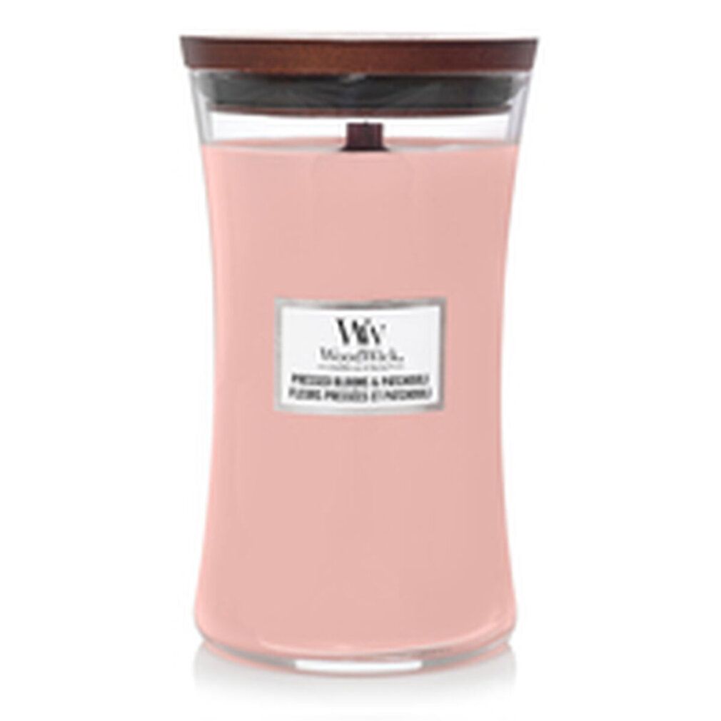 Candela profumata rosa con stoppino in legno e coperchio. Etichetta con nome del prodotto e logo. Contenitore di vetro.