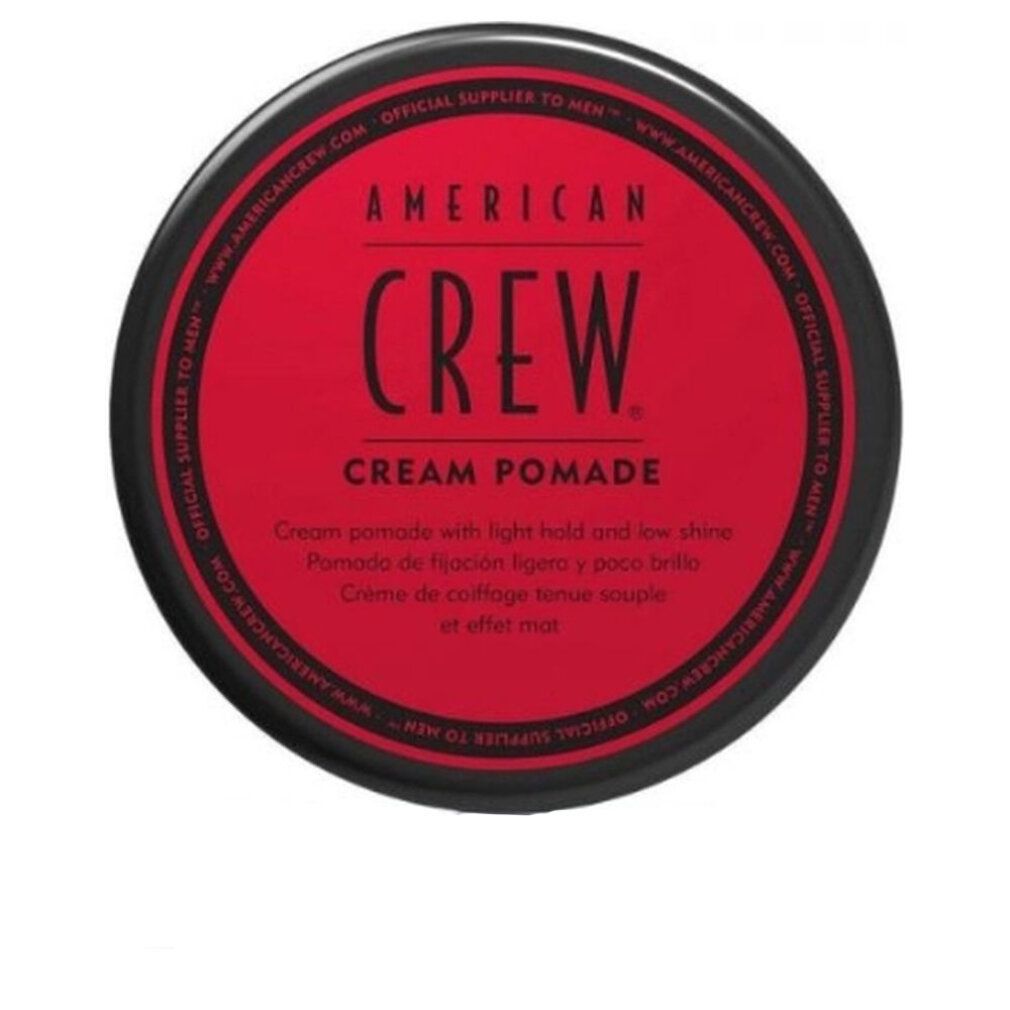 Barattolo rosso American Crew Cream Pomade con coperchio nero. Testo sull'etichetta.