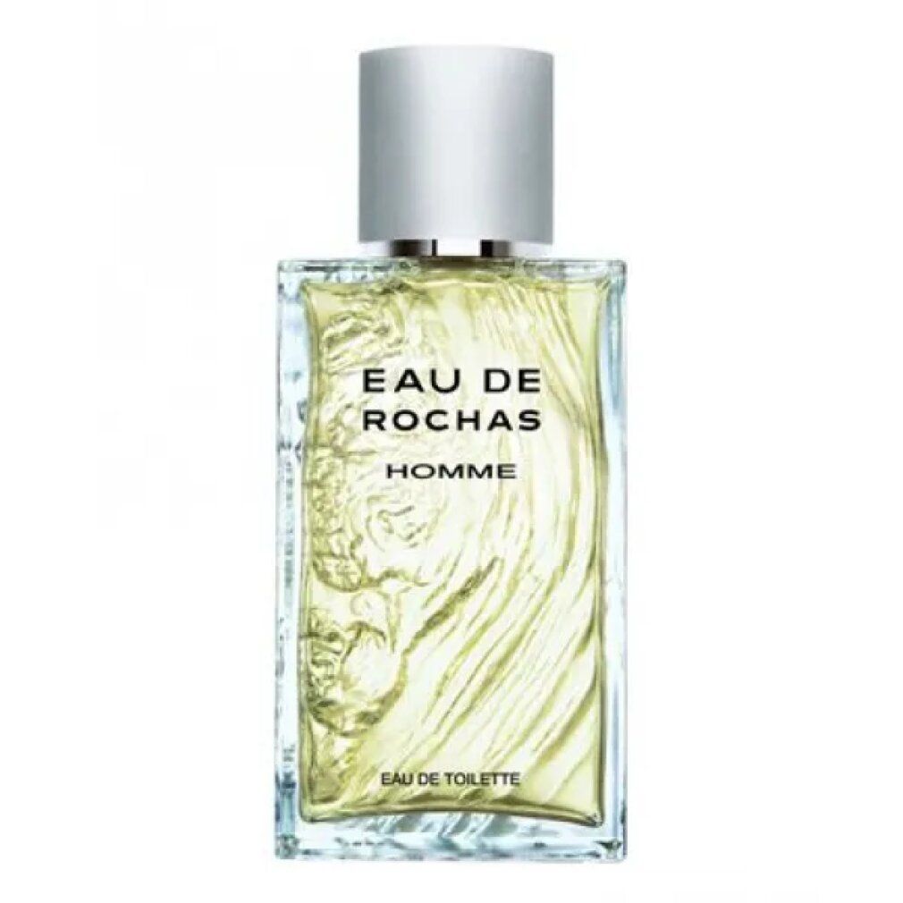 Flacone in vetro con tappo argentato. Scritta: Eau de Rochas Homme Eau de Toilette. Contenuto chiaro, giallognolo. Rilievo sul davanti.