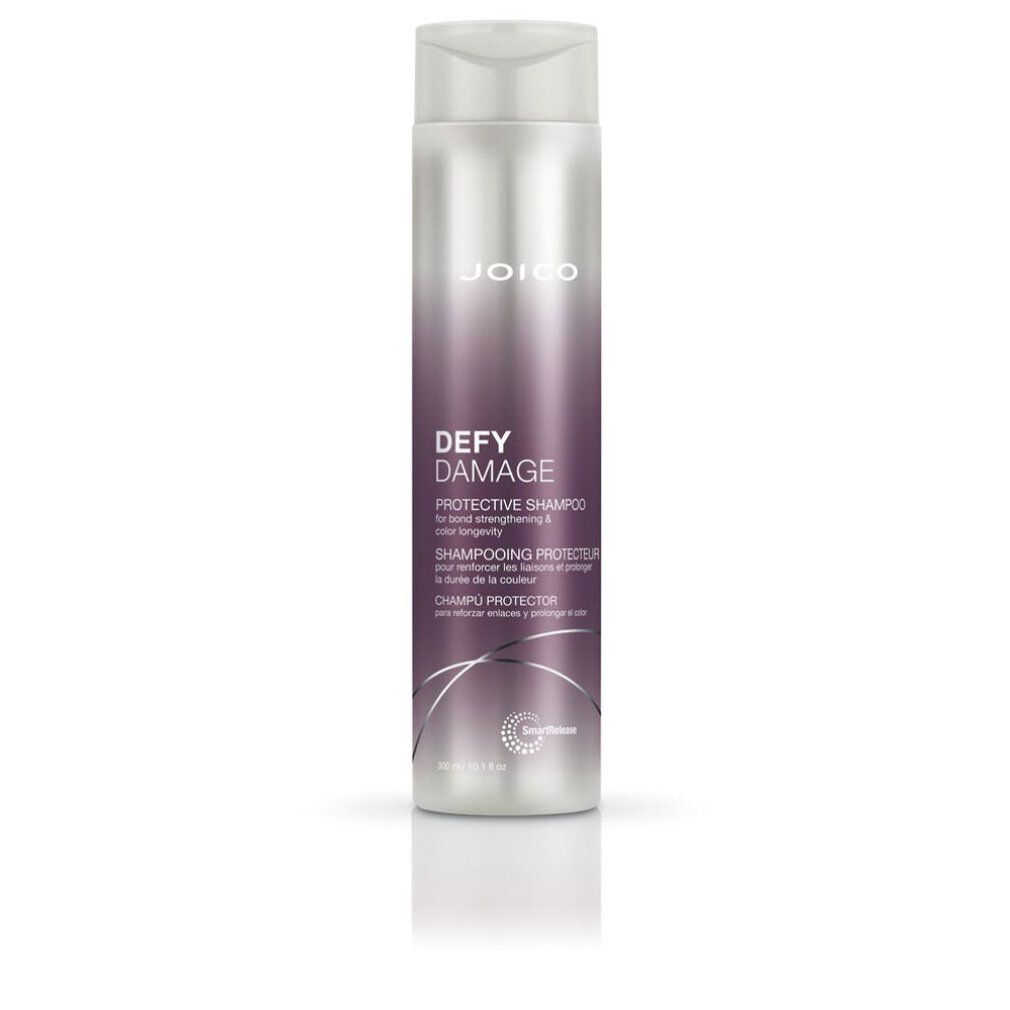 Shampoo protettivo Joico Defy Damage. Flacone con sfumatura viola. Testo: Protective Shampoo, per forza e durata del colore.
