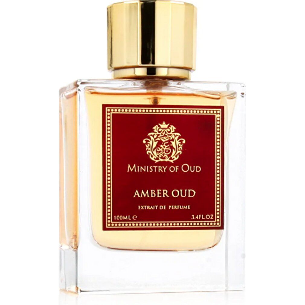 Flacone di profumo quadrato con tappo dorato. Etichetta rossa con testo. Liquido ambrato. Su sfondo bianco.