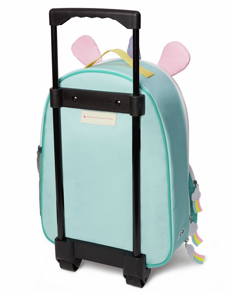 Vista posteriore della valigia per bambini turchese con design unicorno. Maniglia telescopica e ruote nere. Tasca a rete laterale.