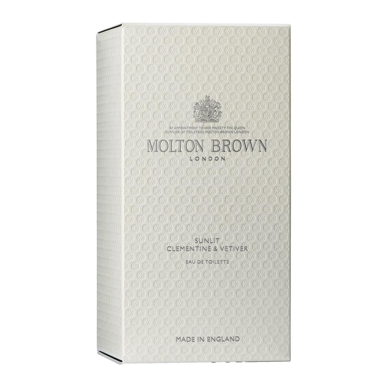 Confezione bianca con motivo in rilievo. Scritta: Molton Brown London, Sunlit Clementine & Vetiver, Eau de Toilette.