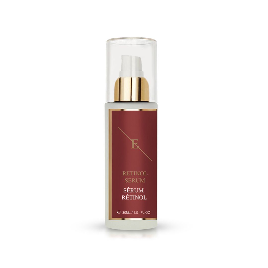 Flacone di siero con tappo dorato ed etichetta rossa. Testo: Retinol Serum, Sérum Rétinol. Contenitore in vetro trasparente.