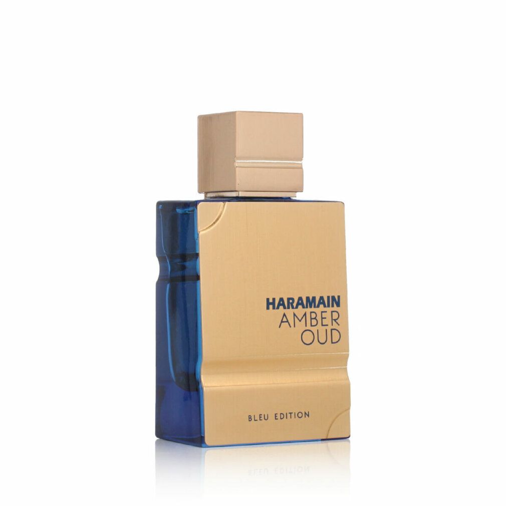 Flacone di profumo dorato con tappo dorato e base blu. Nome del prodotto e logo del marchio visibili.
