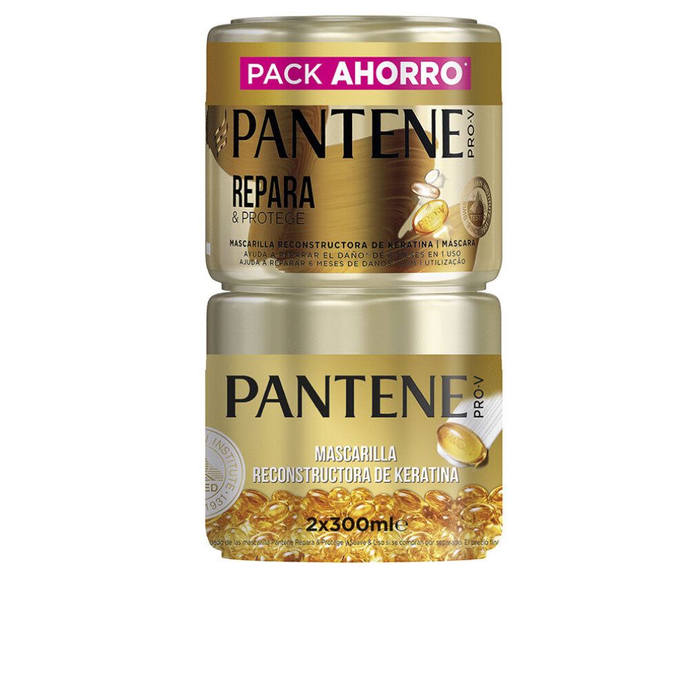 Due barattoli dorati impilati. Scritta: PANTENE PRO-V, RIPARA & PROTEGGE, MASCHERA. Barattolo inferiore: MASCHERA RECONSTRUCTORA DE KERATINA.