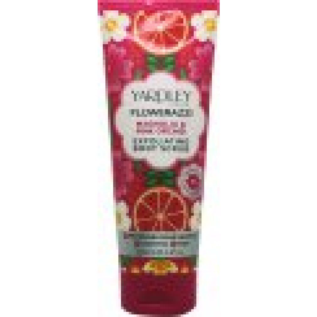 Tubo rosa con design floreale e nome del prodotto. Testo: Flowerazzi Magnolia & Pink Orchid Exfoliating Body Scrub.