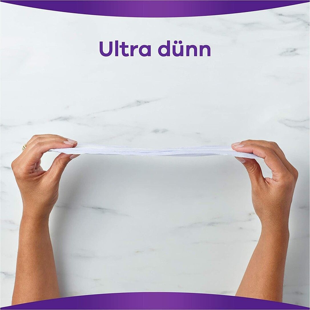 Mani che tengono un assorbente Always Discreet sottile. Testo: Ultra sottile.