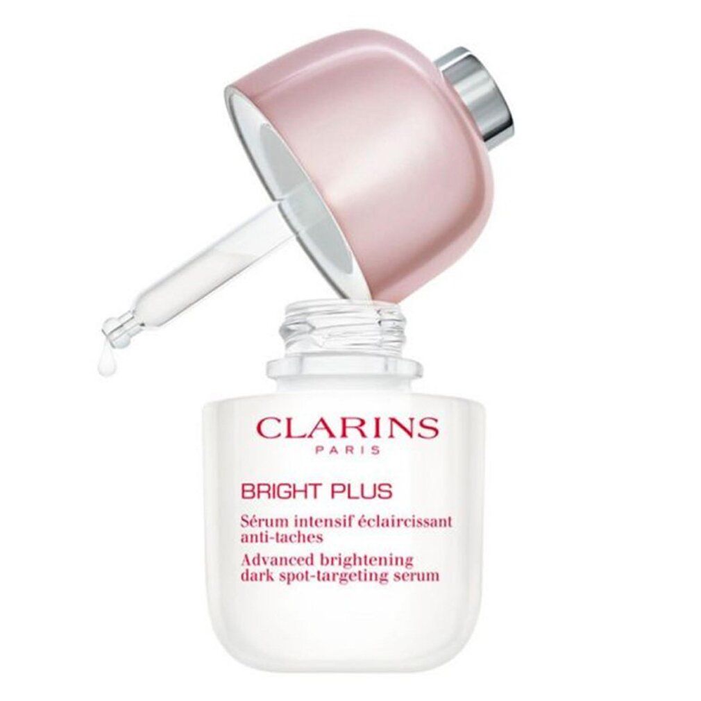 Flacone di siero Clarins Bright Plus con pipetta. Flacone bianco, tappo rosa. Scritta: Bright Plus, Sérum intensif éclaircissant anti-taches.