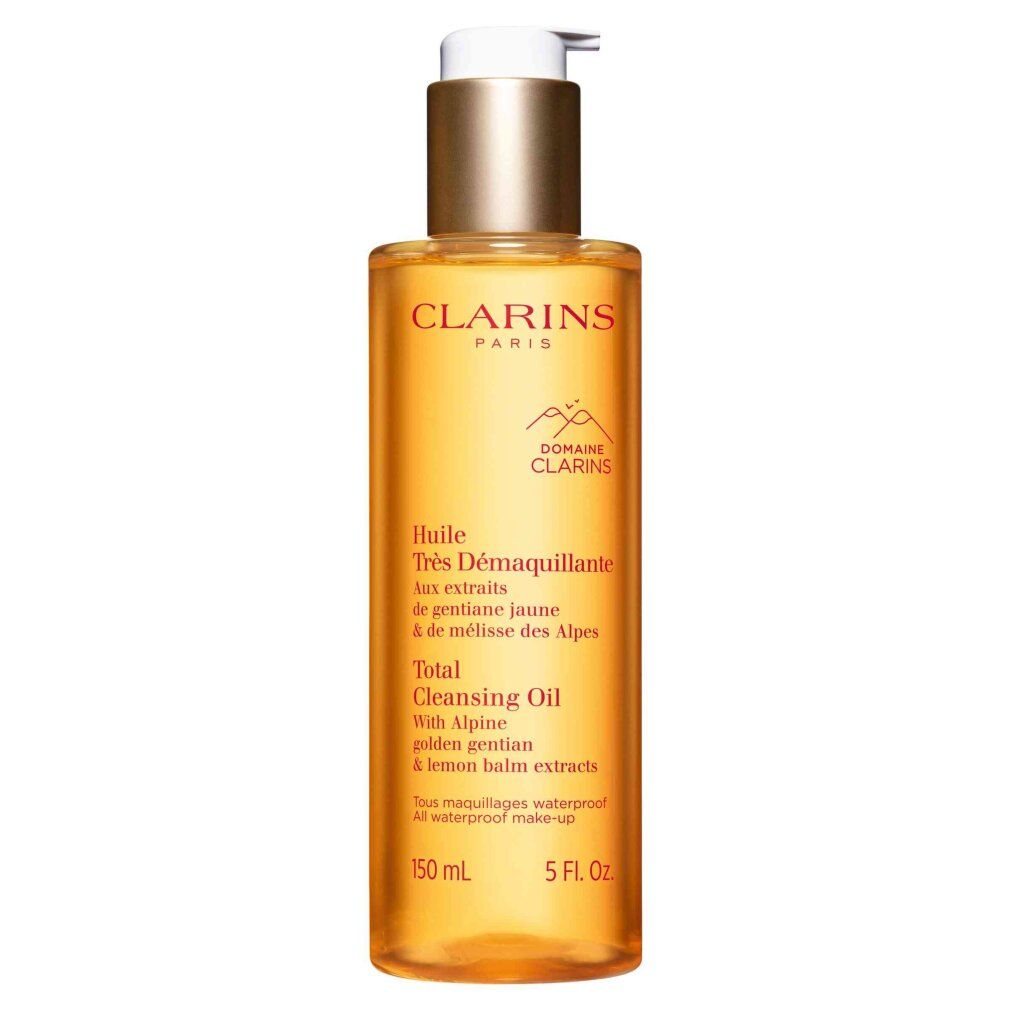 Clarins Total Cleansing Oil: flacone di olio detergente dorato con erogatore a pompa. Contiene estratti alpini.