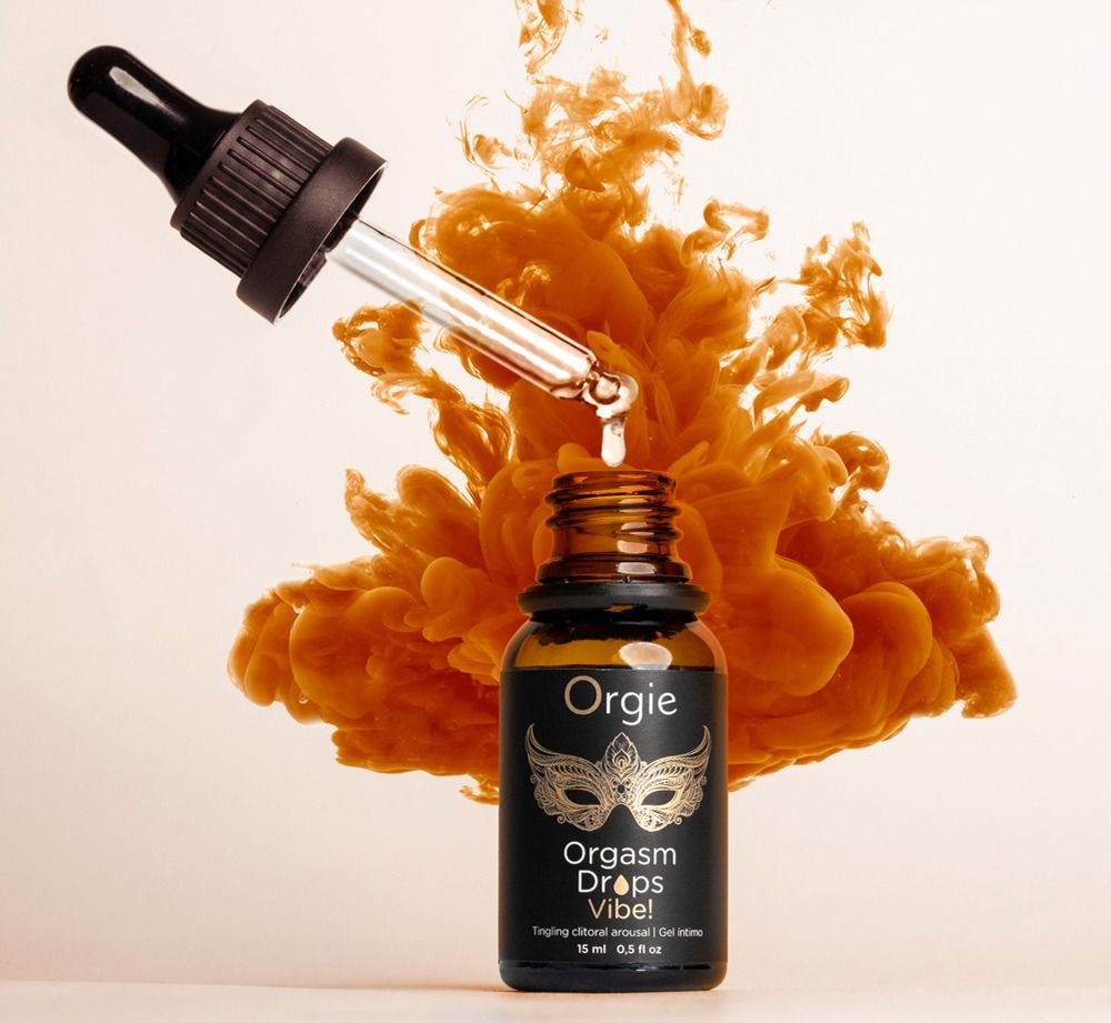 Flacone marrone con contagocce. Nome del prodotto: Orgie Orgasm Drops Vibe! Gocce che cadono nel flacone. Sfondo: fumo arancione.