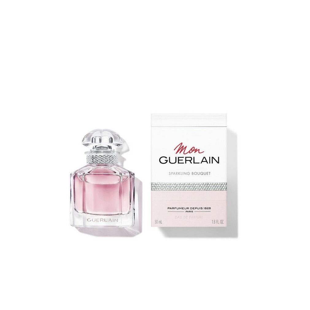 Flacone di profumo e confezione. Flacone con liquido rosa e tappo argentato. Confezione con "Mon Guerlain" e "Sparkling Bouquet".
