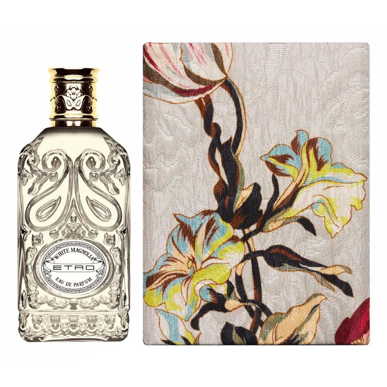 Etro White Magnolia EdP Nat. Spray e scatola. Flacone a sinistra, scatola a destra. Scatola con motivi floreali.