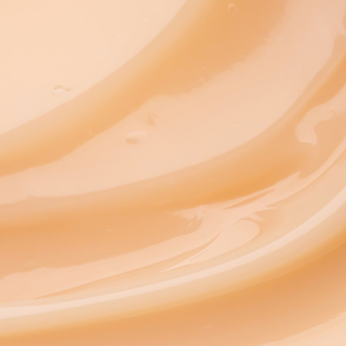 Primo piano di una sostanza ondulata color crema. Texture lucida.